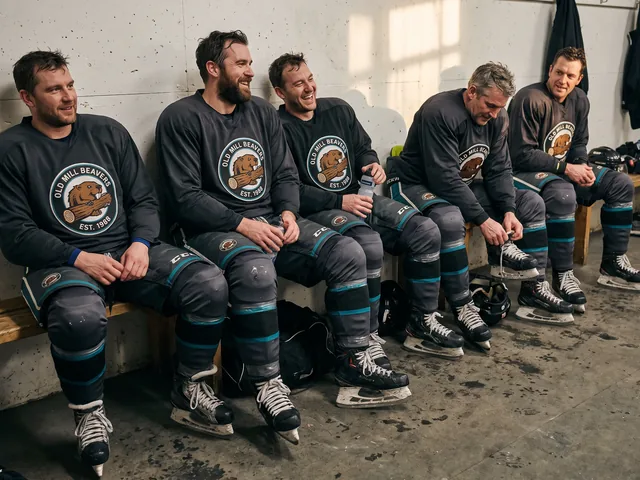 Adult league team on the bench after a game in charcoal and teal hockey pants