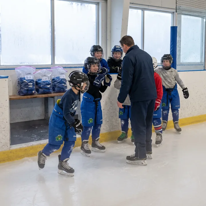 Youth club at first practice in electric blue classic-fit hockey pants with a frog crest