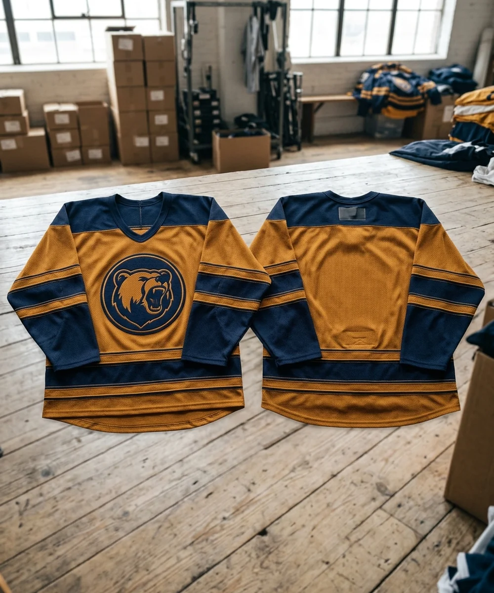 Away hockey jersey front and back on a light base with the same crest, font and stripes