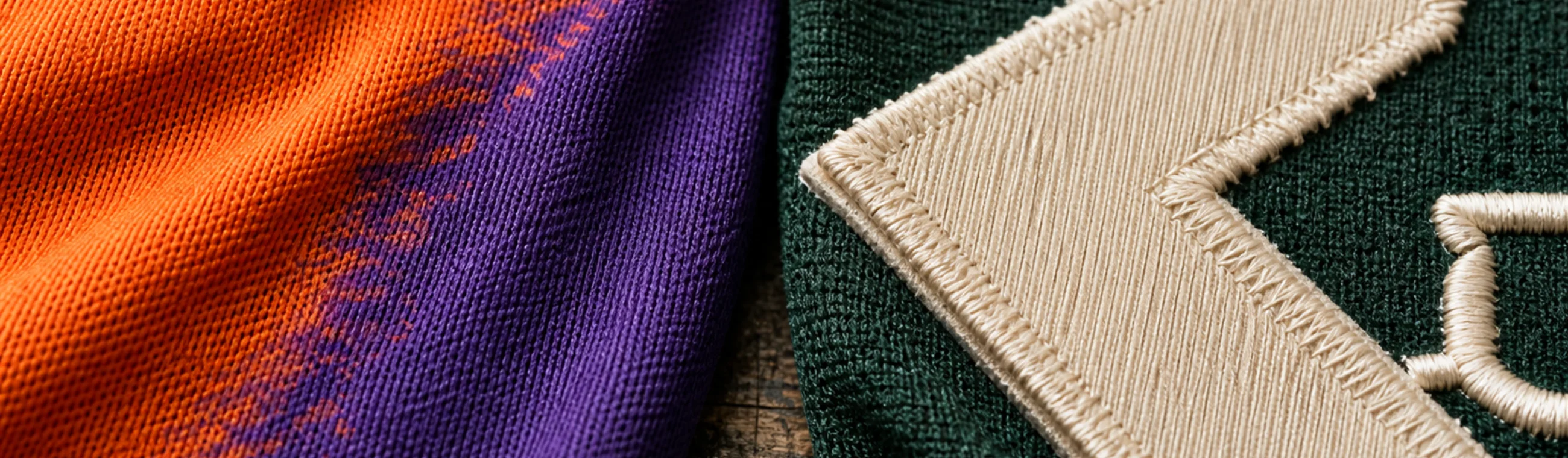 Split image: orange and purple sublimated color in a knit surface on the left, a stitched forest green twill edge and raised embroidery thread on the right